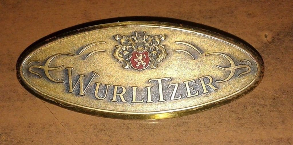 Wurlitzer piano logo brass